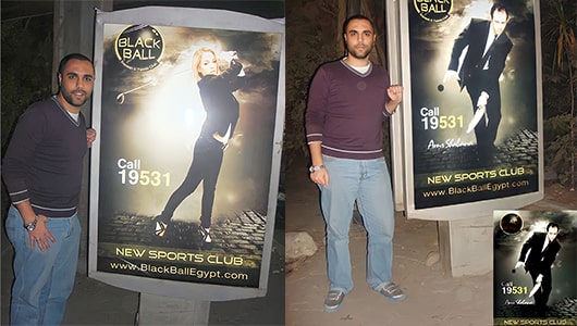 Albert Gamil the best matketing director in egypt infront of black ball outdoor ad designed by him